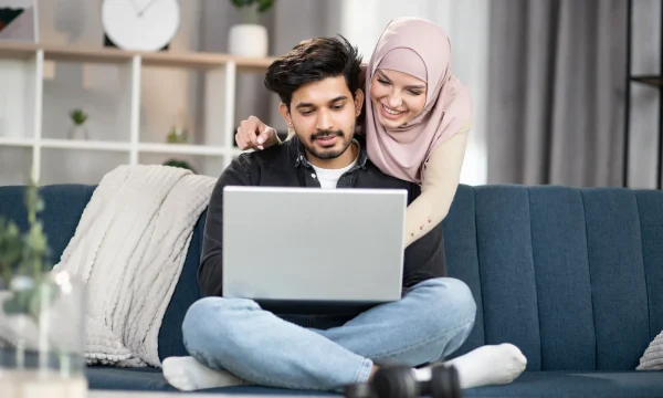 couple viewing online content on couch