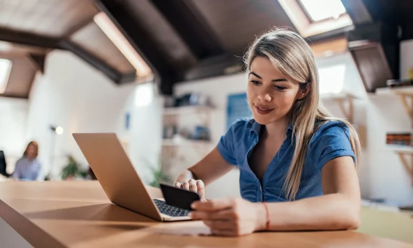 woman making online purchase on her laptop